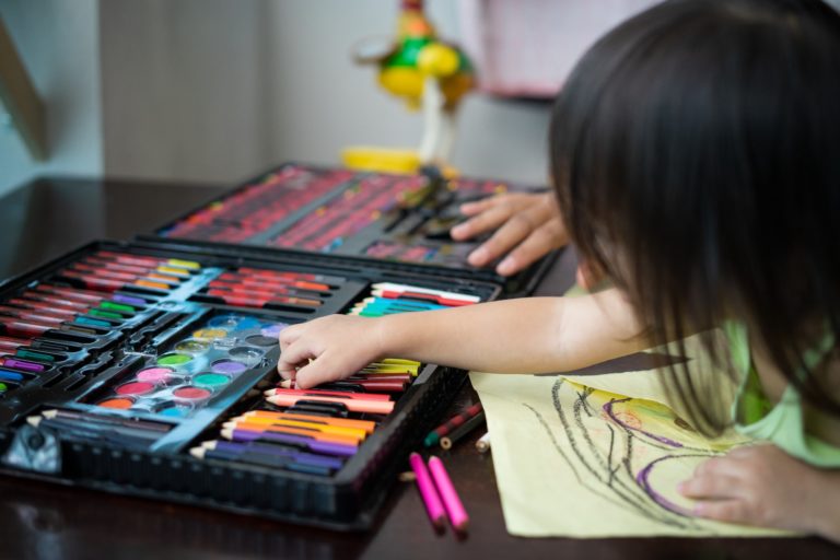 toddler-choosing-colours-while-drawing-on-a-paper-at-home--768x512